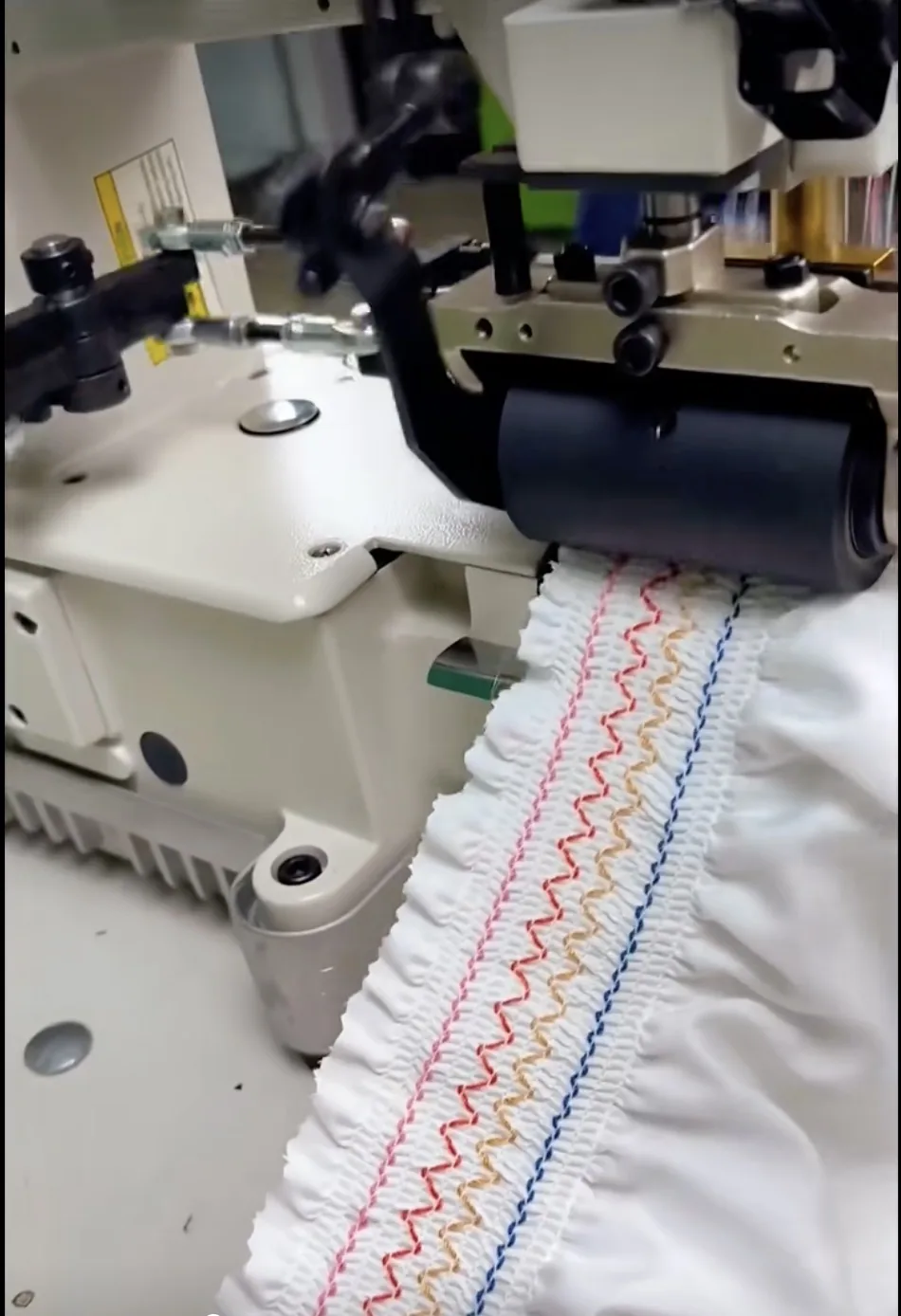 Smocking machine with fabric detail